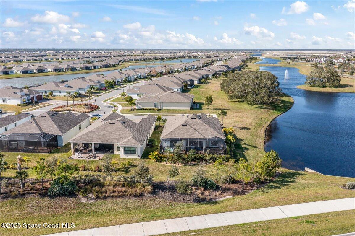 2190 Caravan Place Melbourne, FL 32940 - Photo 44 of 46 an aerial view of house with yard and ocean view