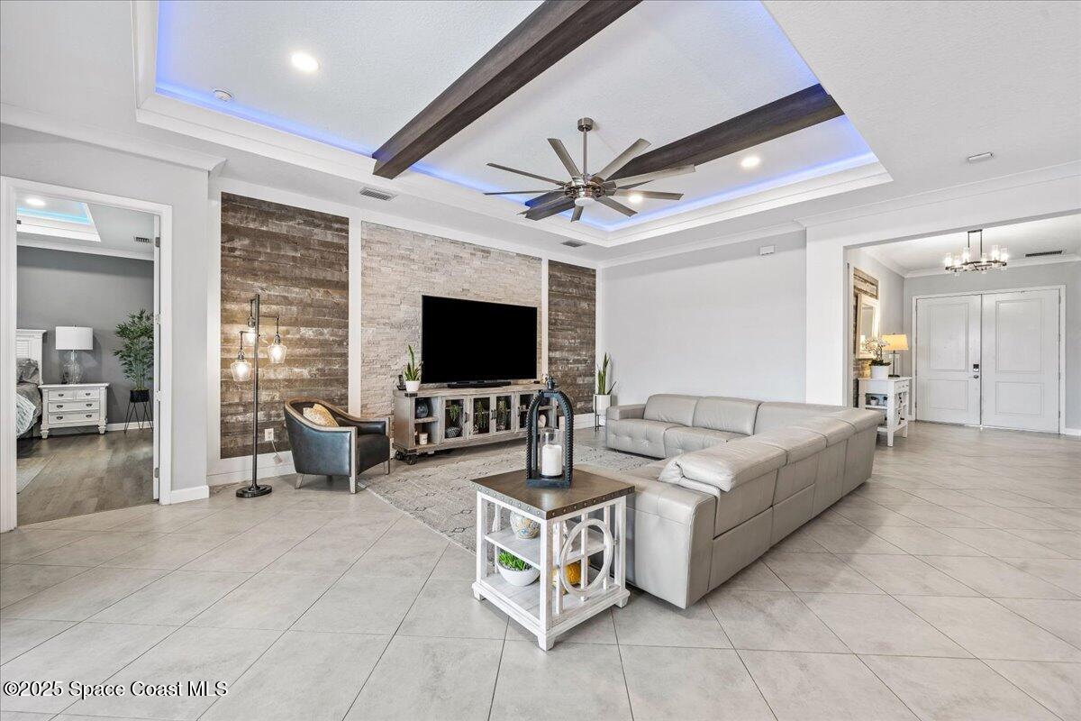 2190 Caravan Place Melbourne, FL 32940 - Photo 5 of 46 a living room with furniture and a flat screen tv