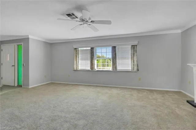 a view of an empty room with a window