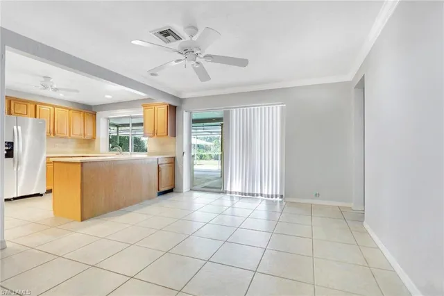a view of a kitchen with a sink cabinet and a window