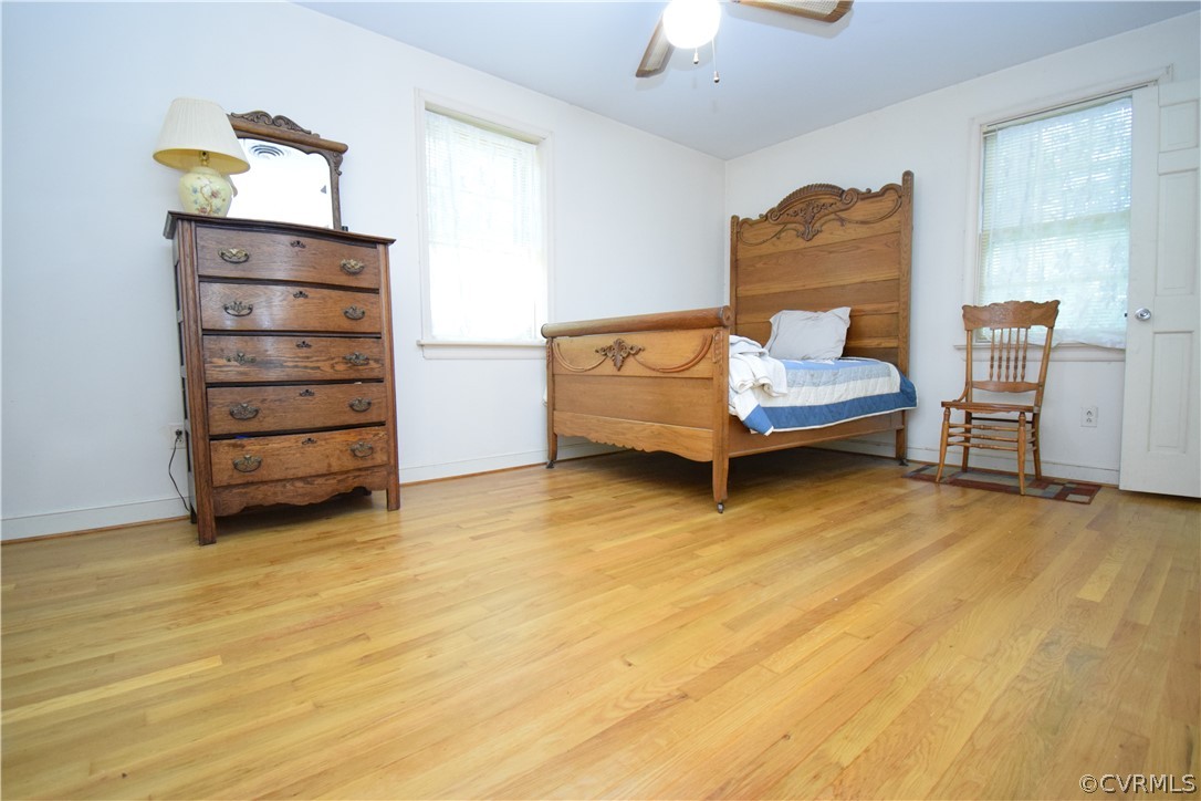 10921 Stepney Road Chester, VA 23831 - Photo 28 of 34 a room with furniture and a wooden floor