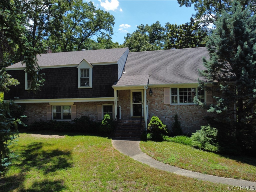10921 Stepney Road Chester, VA 23831 - Photo 3 of 34 a front view of a house with a yard