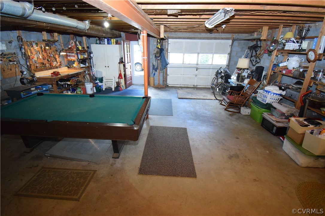 10921 Stepney Road Chester, VA 23831 - Photo 33 of 34 a view of a garage with a table and a chair