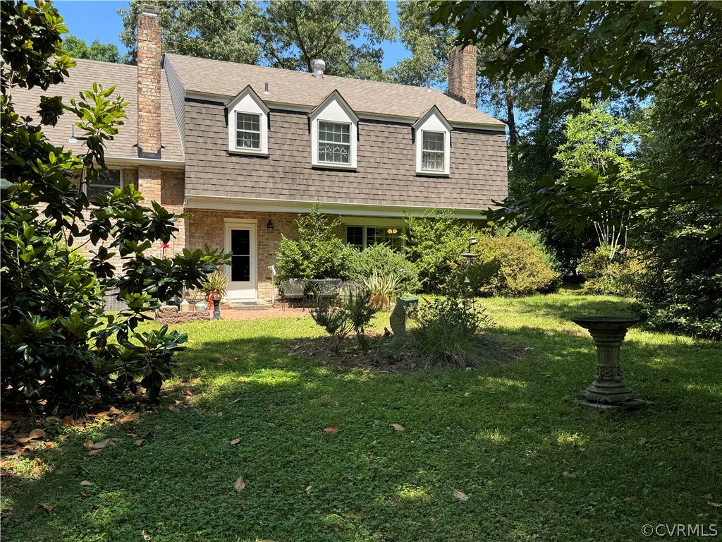 10921 Stepney Road Chester, VA 23831 - Photo 7 of 34 a front view of a house with a garden