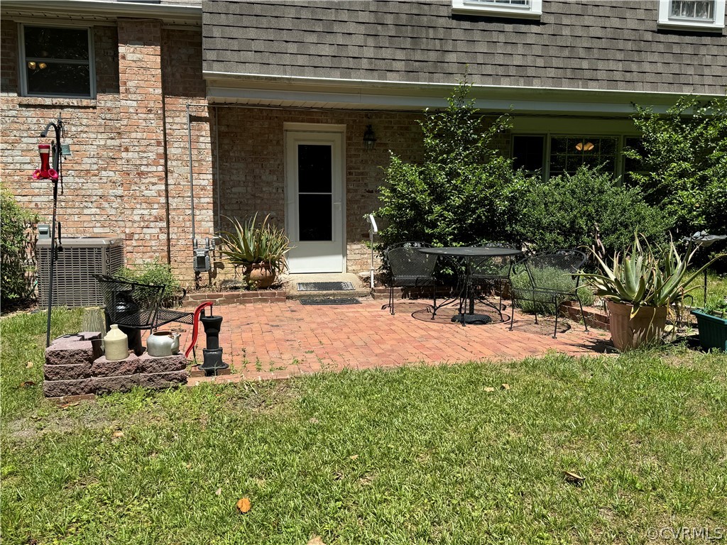 10921 Stepney Road Chester, VA 23831 - Photo 8 of 34 a view of a house with backyard and sitting area