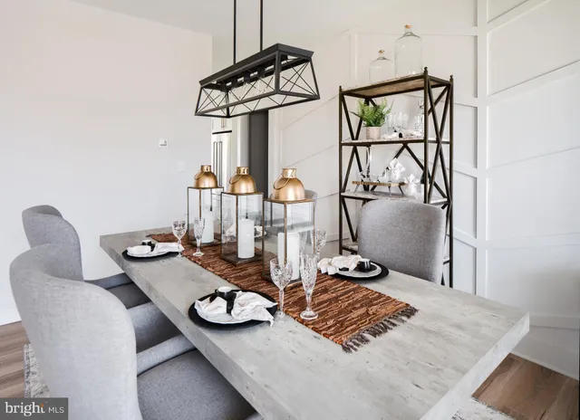 a kitchen with a dining table and chairs
