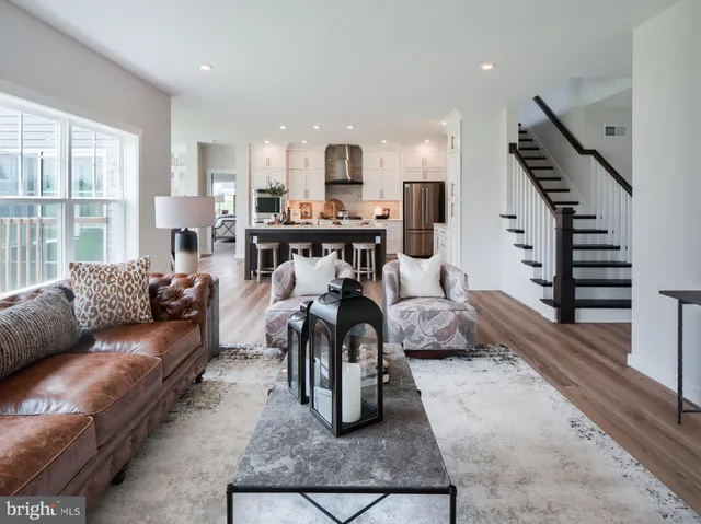 a white bath tub sitting in a bathroom next to a window
