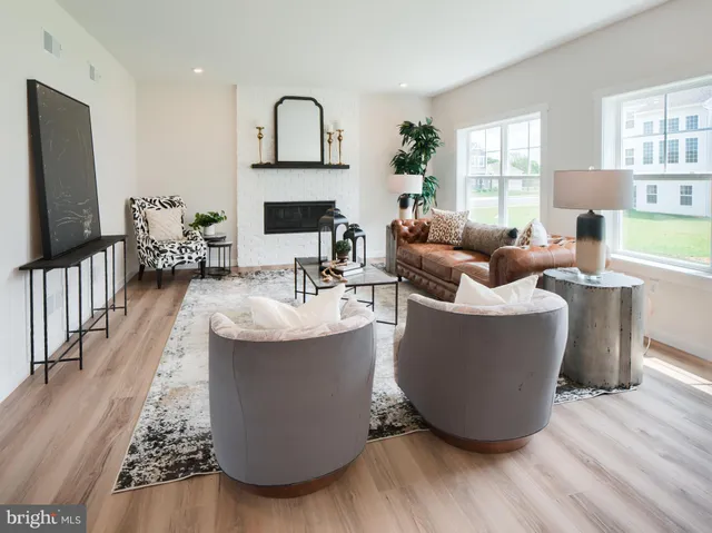 a white bath tub sitting in a bathroom next to a yard