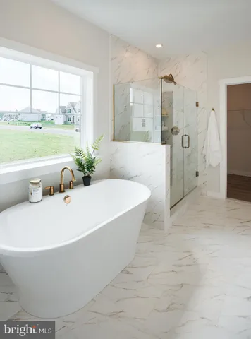 a view of kitchen with furniture and wooden floor