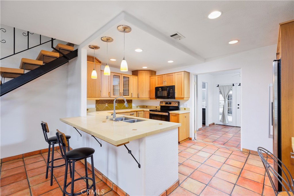 1422 Everton Place Riverside, CA 92507 - Photo 1 of 1 a kitchen with a table and chairs in it