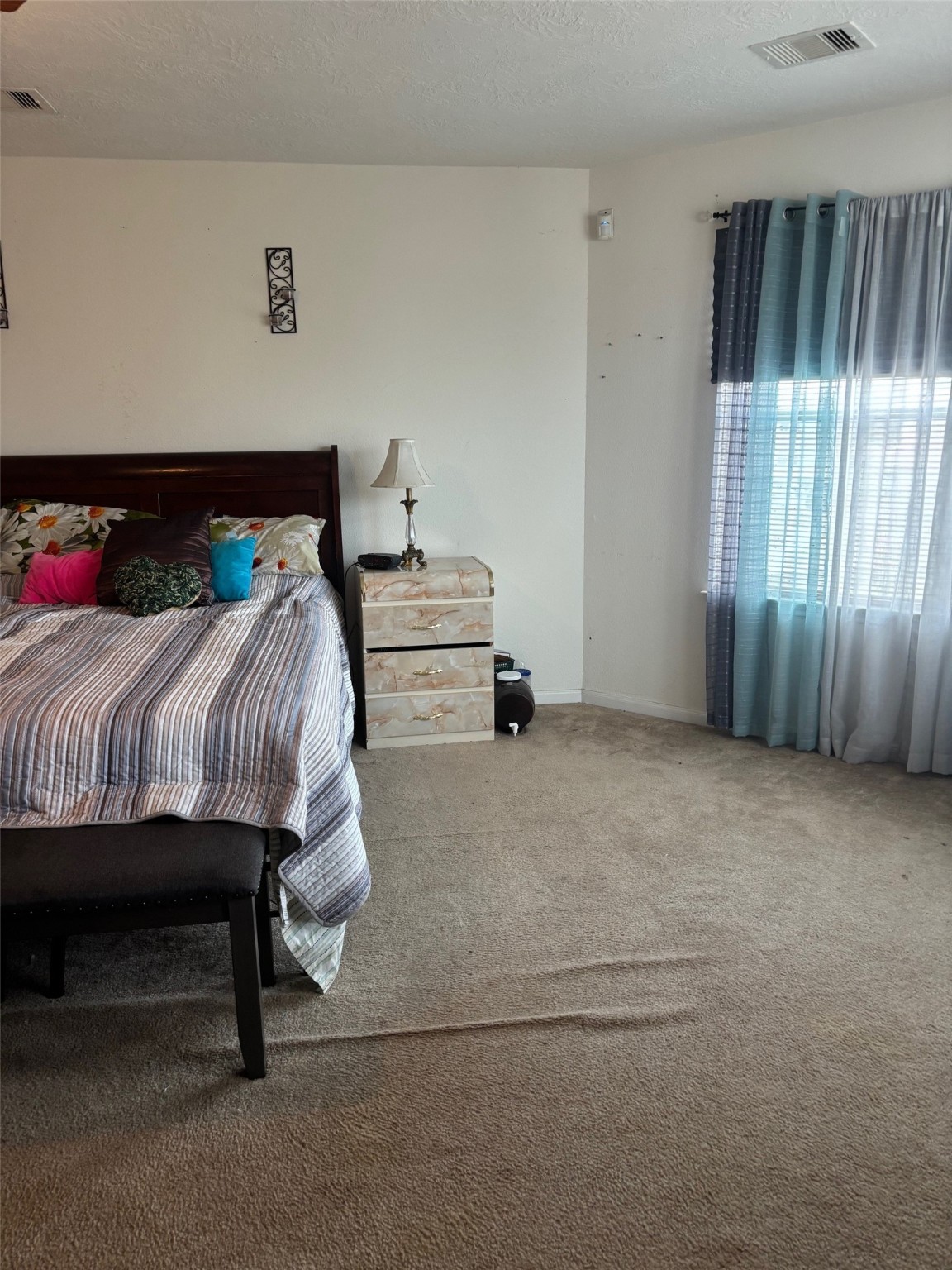 911 Belshear Court Houston, TX 77073 - Photo 16 of 21 a bedroom with a bed and a window