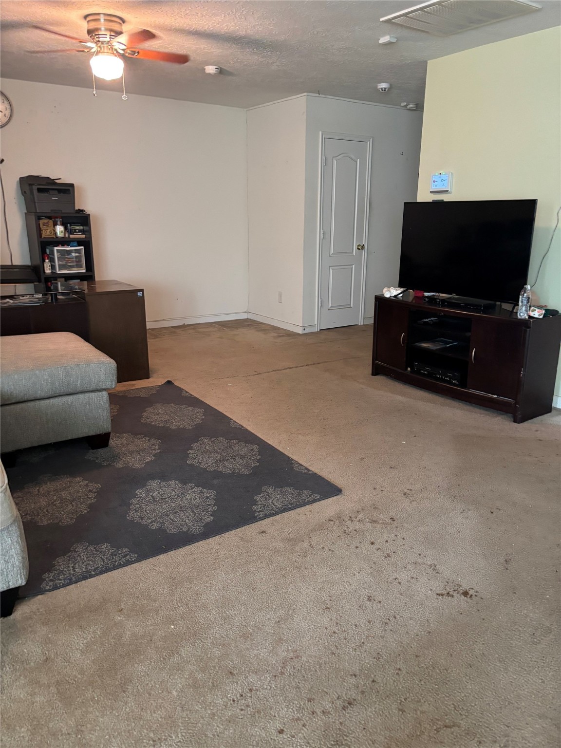 911 Belshear Court Houston, TX 77073 - Photo 5 of 21 a living room with furniture and a flat screen tv