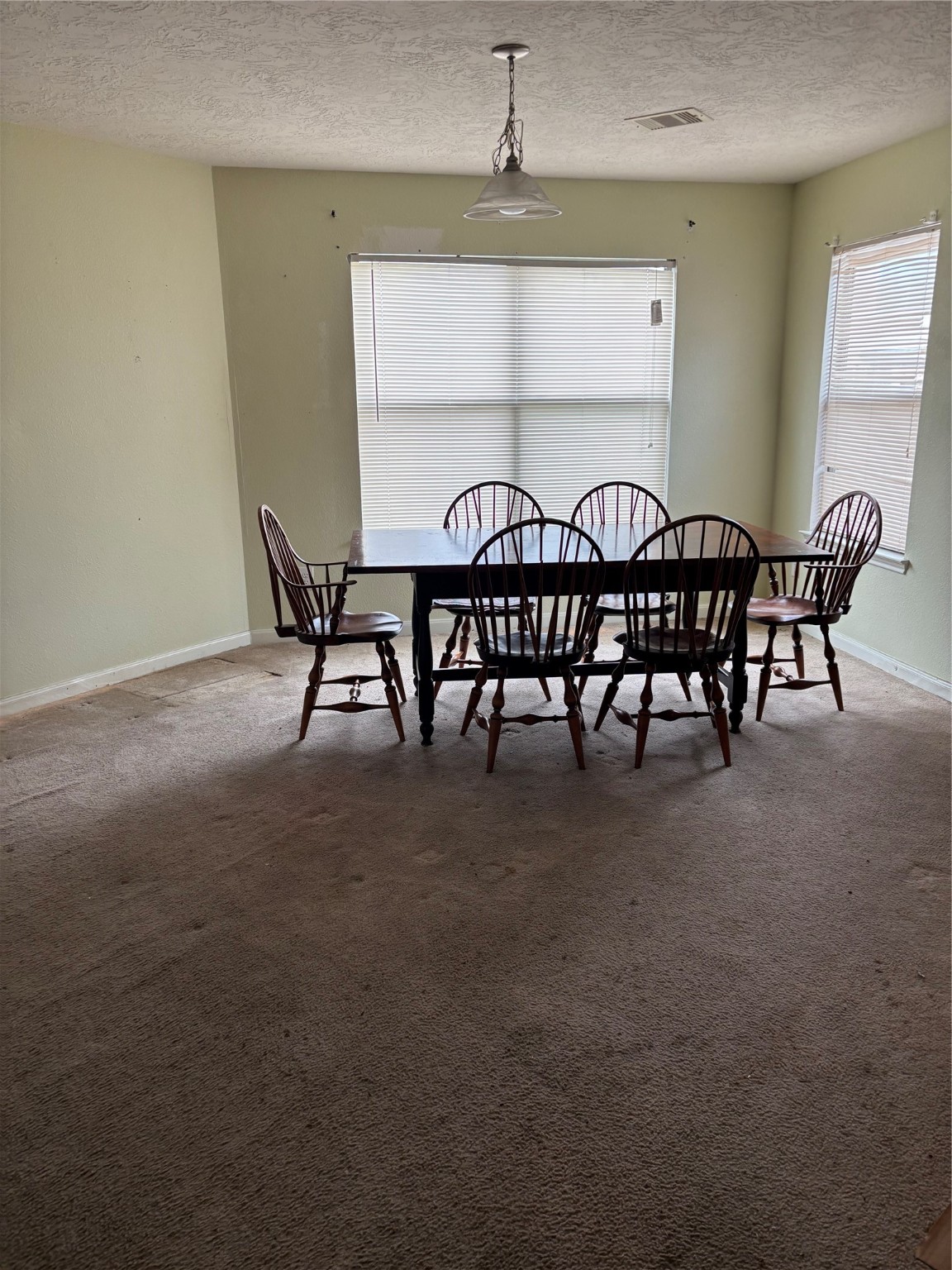 911 Belshear Court Houston, TX 77073 - Photo 6 of 21 a view of a dining room with furniture and a window