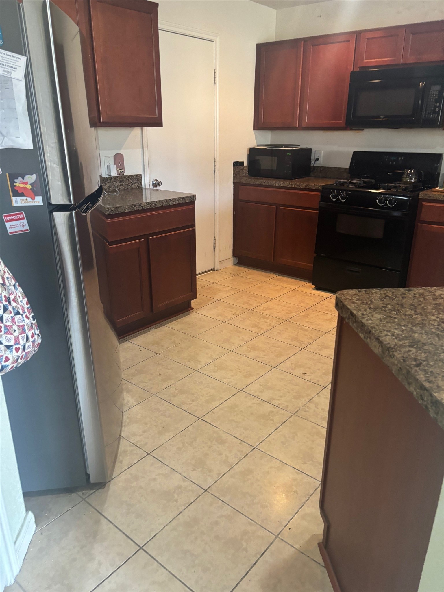911 Belshear Court Houston, TX 77073 - Photo 8 of 21 a kitchen with stainless steel appliances granite countertop a refrigerator stove and sink