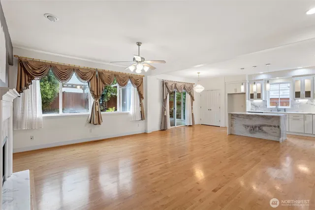 a view of an empty room with a kitchen