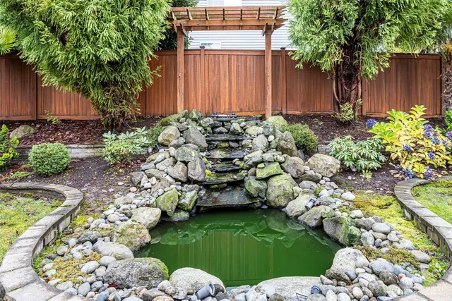 a garden with lots of trees and flowers