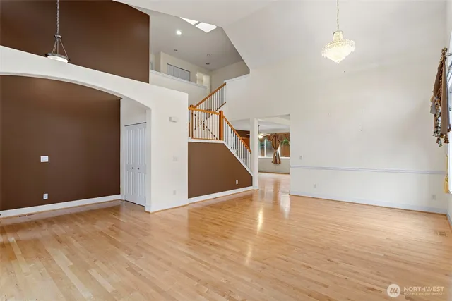 a view of a room with wooden floor
