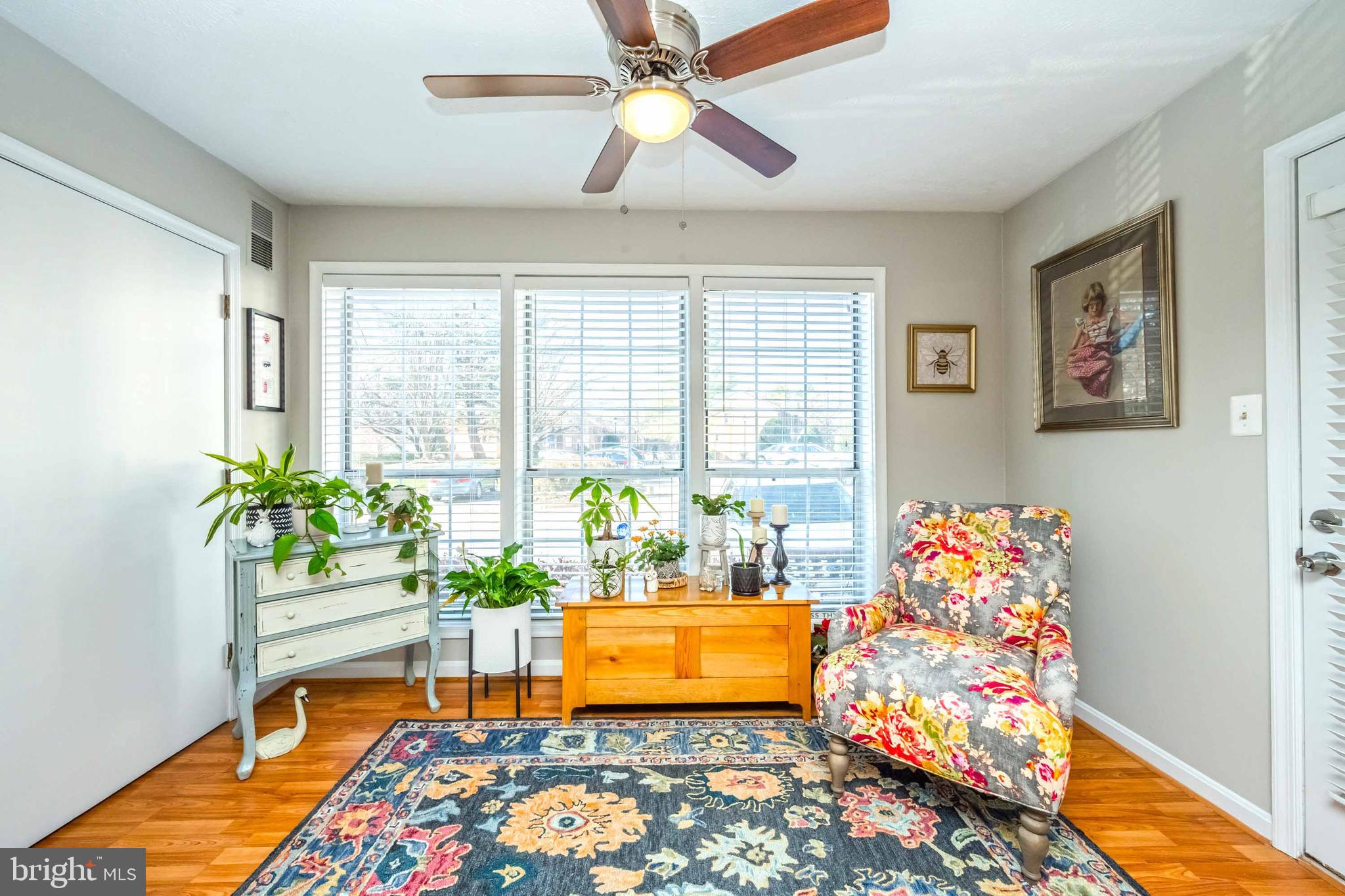 10180 Oakton Terrace Road, Unit 10180 Oakton, VA 22124 - Photo 26 of 29 Delightful sunroom with laminate flooring