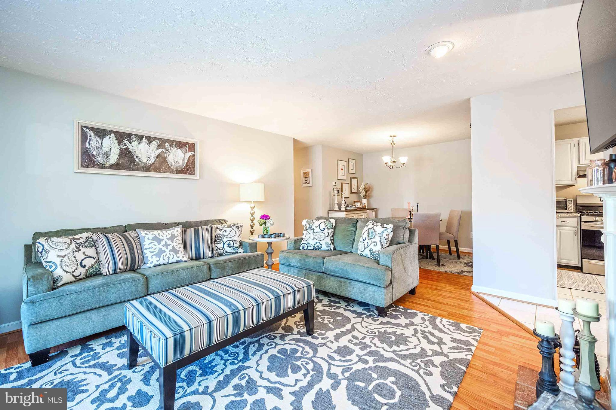 10180 Oakton Terrace Road, Unit 10180 Oakton, VA 22124 - Photo 9 of 29 Living room with beautiful laminate flooring