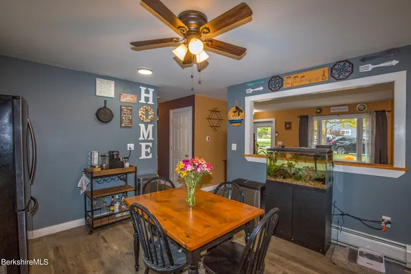 a kitchen that has a table and chairs in it