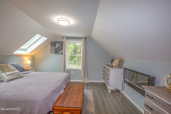 a bed room with a bed and a tv