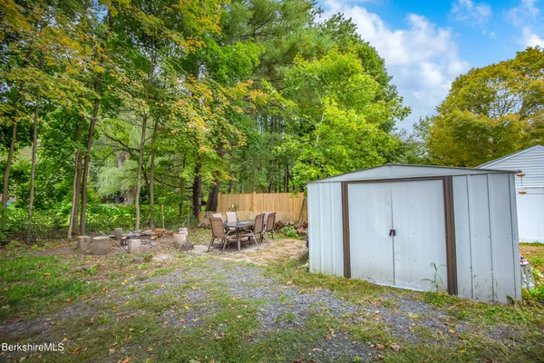 a view of backyard with deck and backyard