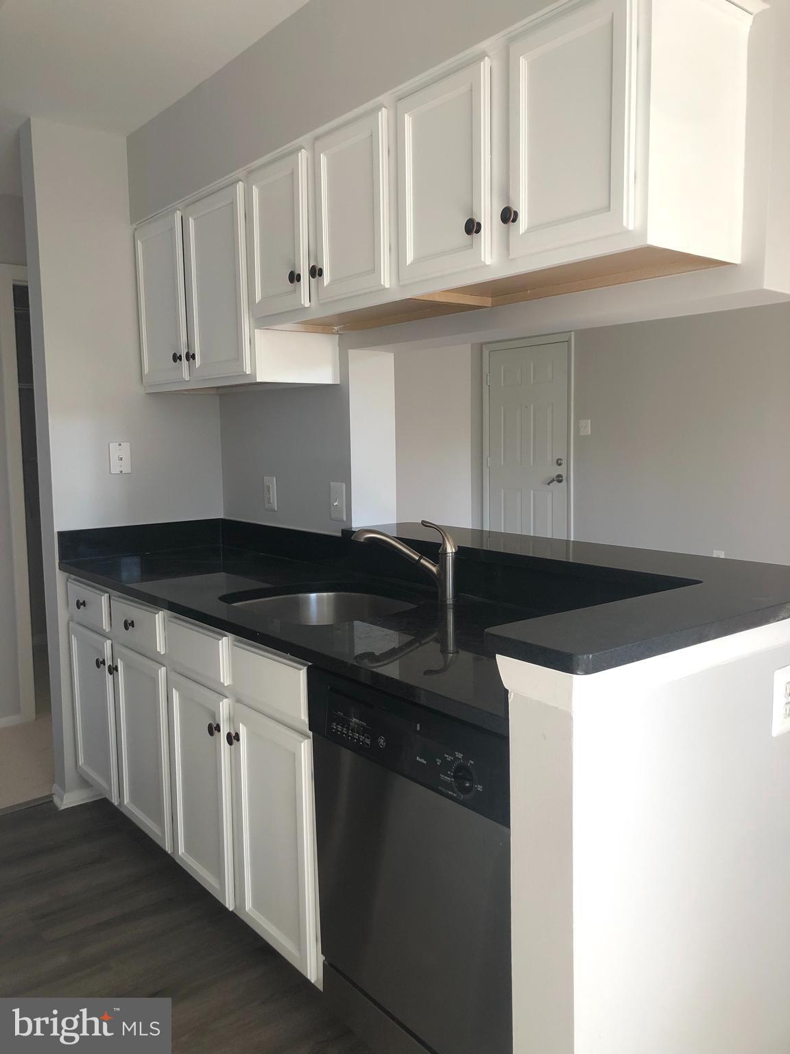 1793 Jonathan Way, Unit I Reston, VA 20190 - Photo 3 of 19 Bright open kitchen into the living room!