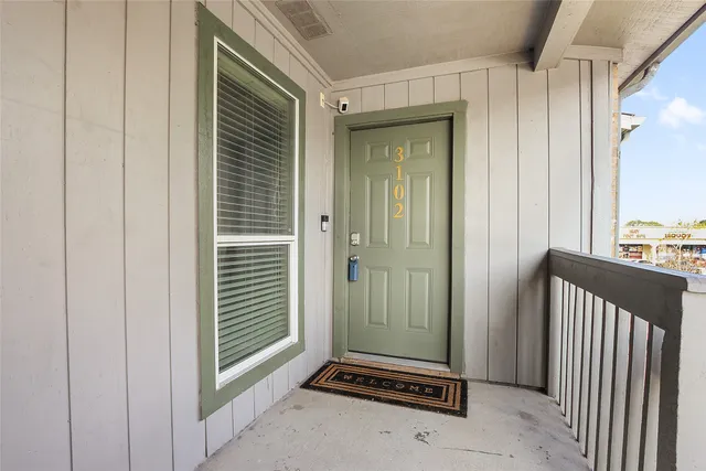 walk in closet with clothes and shoes