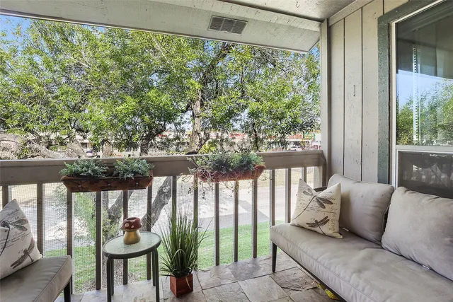 a kitchen with a refrigerator sink and white cabinets