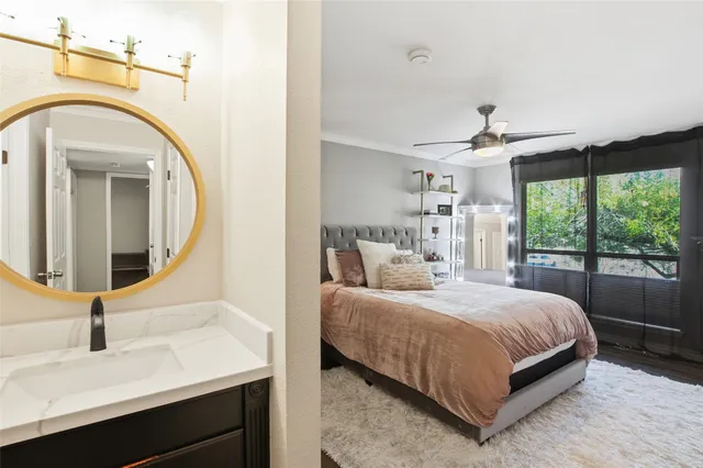 a bathroom with a sink a toilet and shower curtain