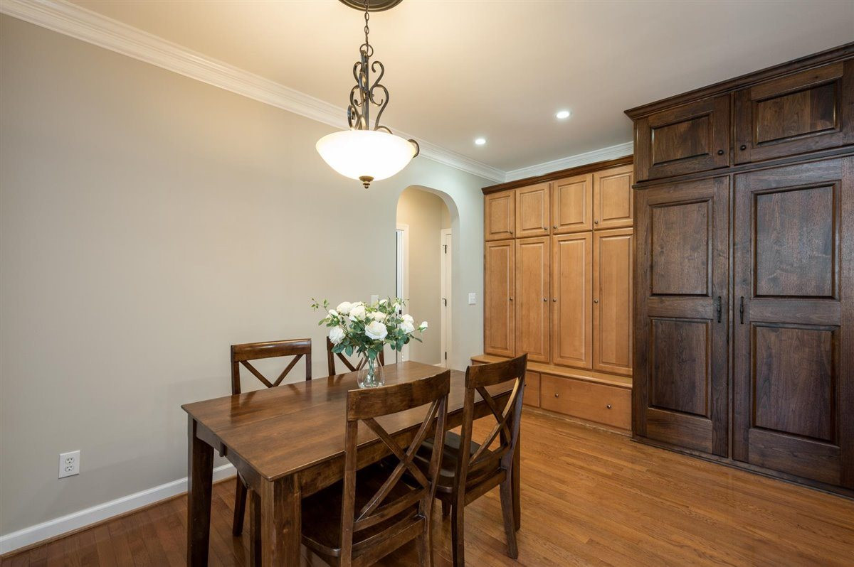 3100 Pyxis Court Raleigh, NC 27614 - Photo 26 of 30 The owner built this space to keep everything neat and organized. Behind the doors are 4 lockers for jackets, backpacks, and shoes. The dark wood doors are the custom built organized pantry with gliding shelves. Drop Zone and Pantry