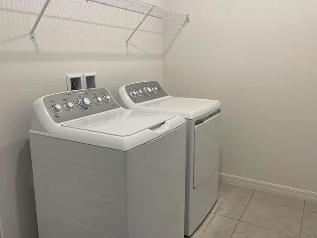 a utility room with dryer and washer