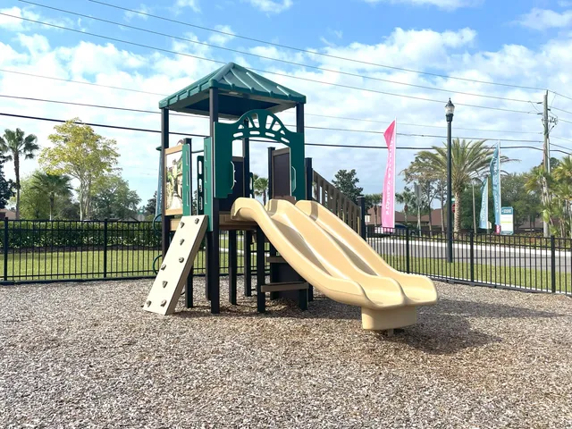 a view of a park with a slide