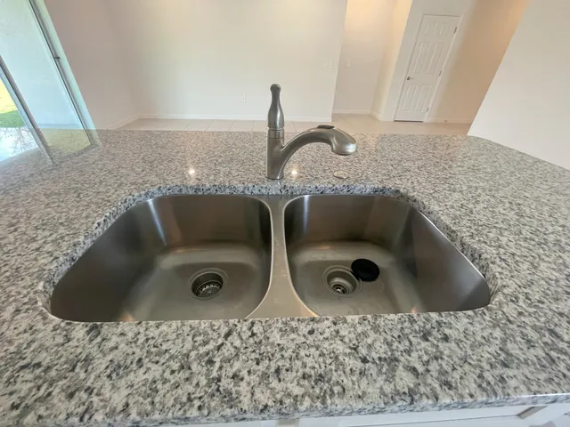 a bathroom with sink and mirror