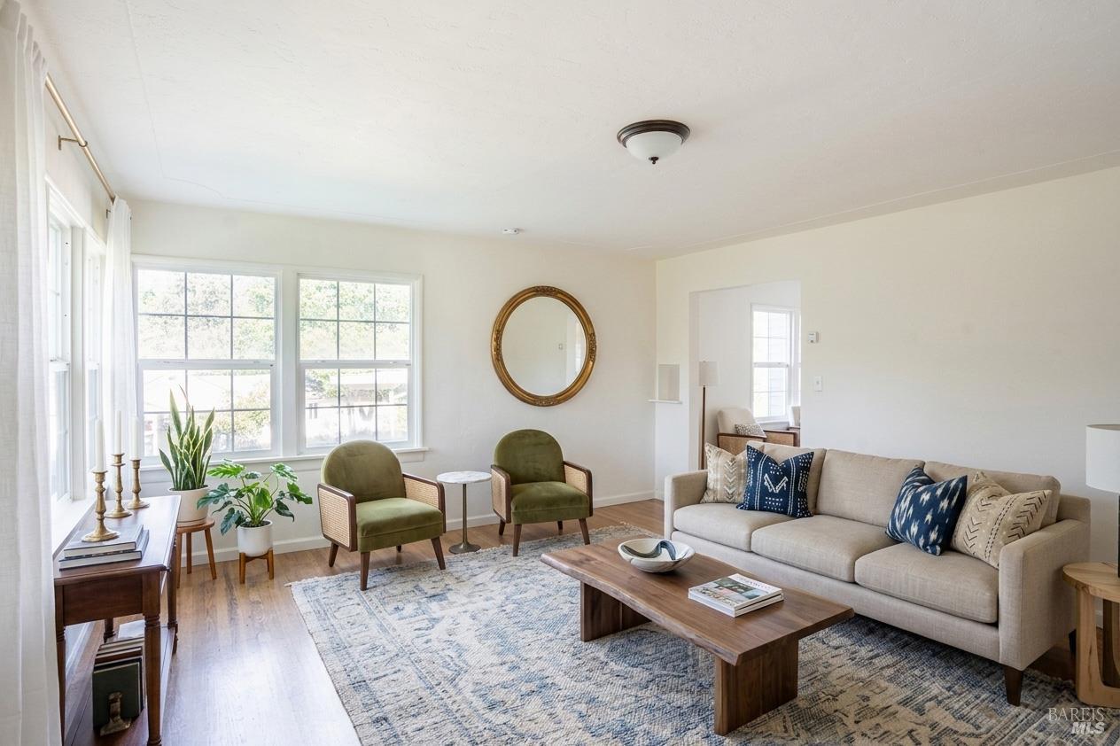 490 Cornish Lane Angwin, CA 94508 - Photo 14 of 30 a living room with furniture a rug a lamp and a large window