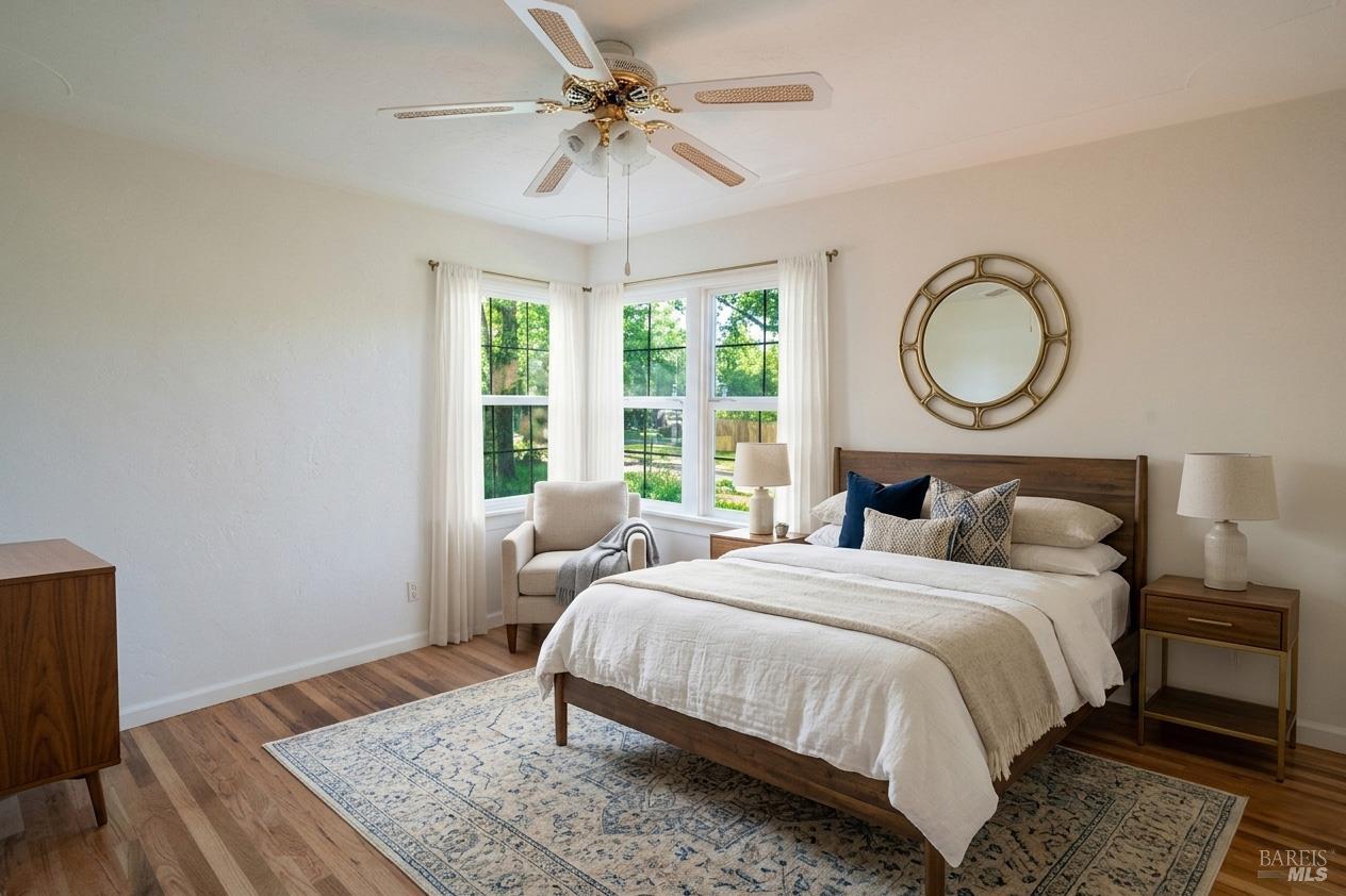 490 Cornish Lane Angwin, CA 94508 - Photo 17 of 30 a bedroom with a bed lamp and a window