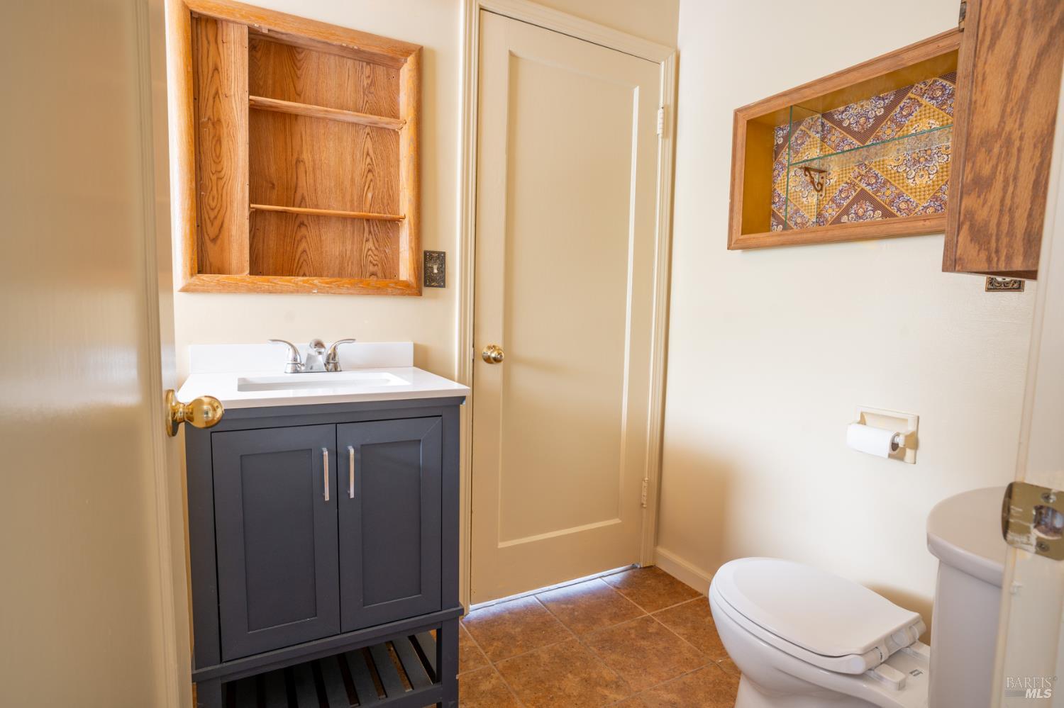 490 Cornish Lane Angwin, CA 94508 - Photo 23 of 30 a bathroom with a toilet a sink and a mirror