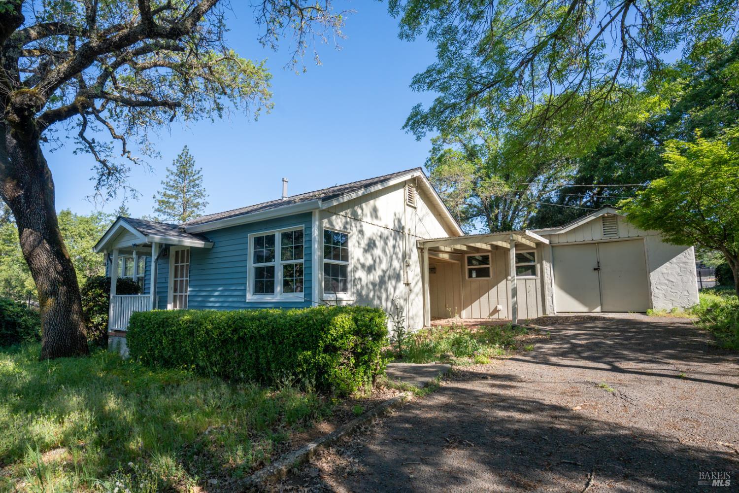 490 Cornish Lane Angwin, CA 94508 - Photo 6 of 30 a front view of a house with a yard and tree