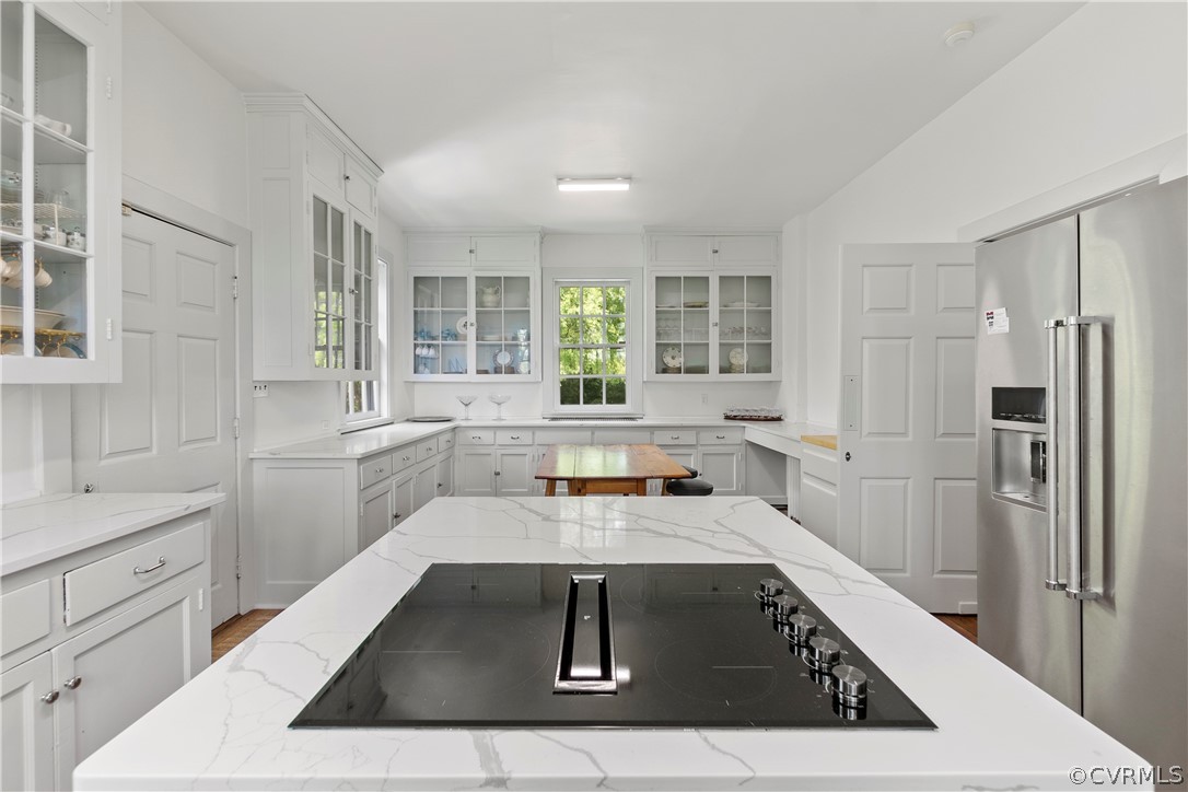 211 Ross Road Henrico, VA 23229 - Photo 17 of 50 a kitchen with a sink a counter top space stainless steel appliances cabinets and a window