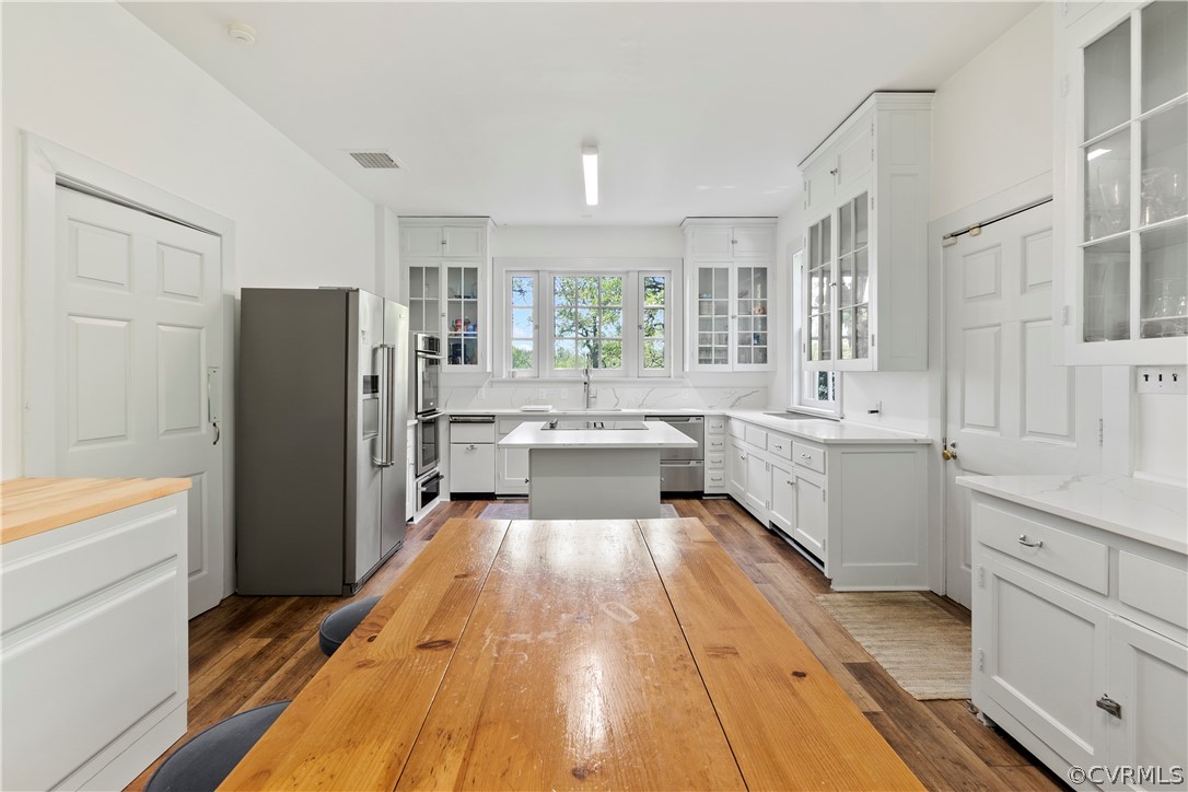 211 Ross Road Henrico, VA 23229 - Photo 18 of 50 a large kitchen with a lot of counter space and a wooden floor
