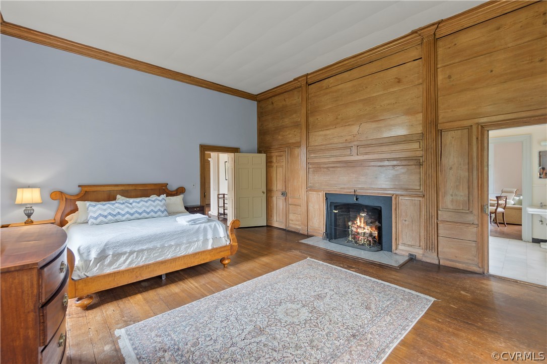 211 Ross Road Henrico, VA 23229 - Photo 27 of 50 a spacious bedroom with a bed and a fireplace
