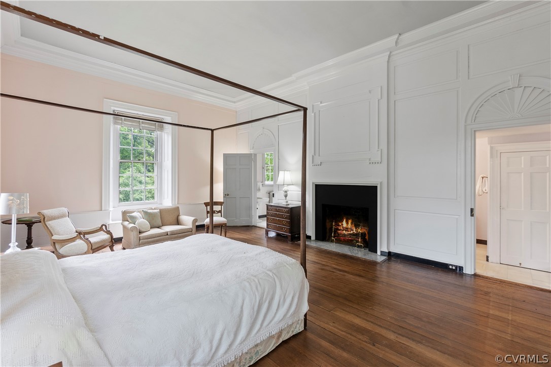 211 Ross Road Henrico, VA 23229 - Photo 30 of 50 a spacious bedroom with a large bed and a fireplace