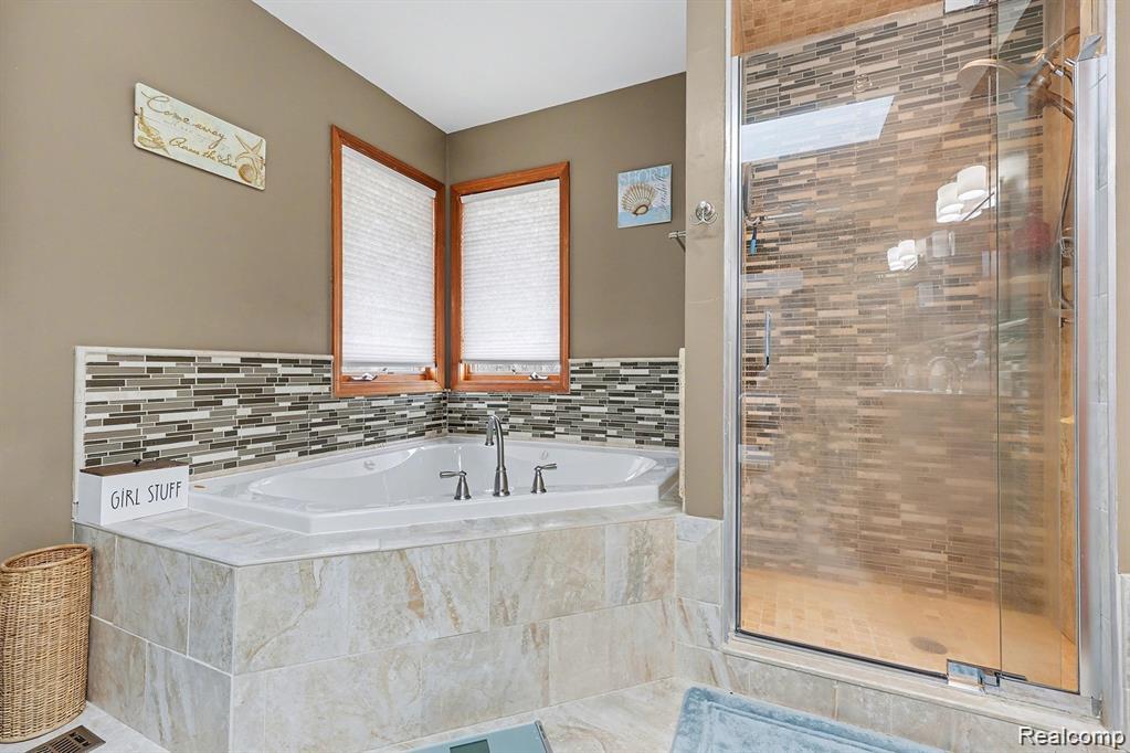 7277 Cardinal Road Algonac, MI 48001 - Photo 29 of 36 Bathroom with a stall shower and a bath
