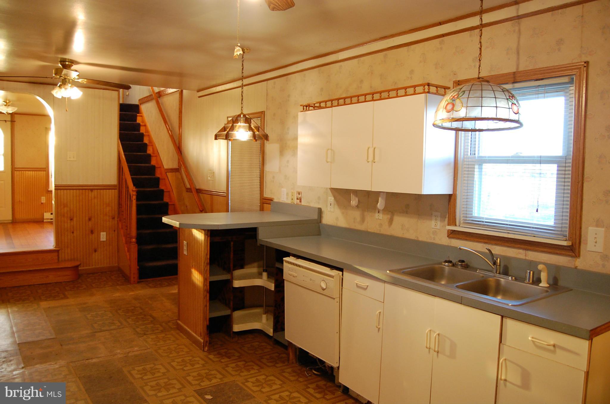 12609 Eaton Road Rocky Ridge, MD 21778 - Photo 12 of 25 a kitchen with a sink cabinets and window