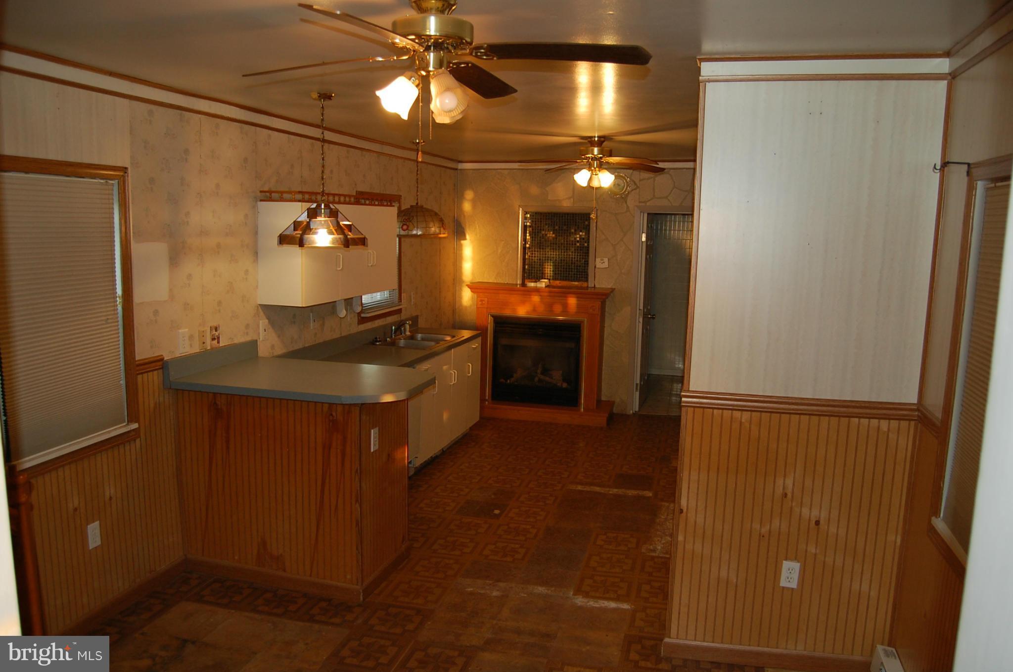 12609 Eaton Road Rocky Ridge, MD 21778 - Photo 13 of 25 a kitchen with refrigerator and cabinets
