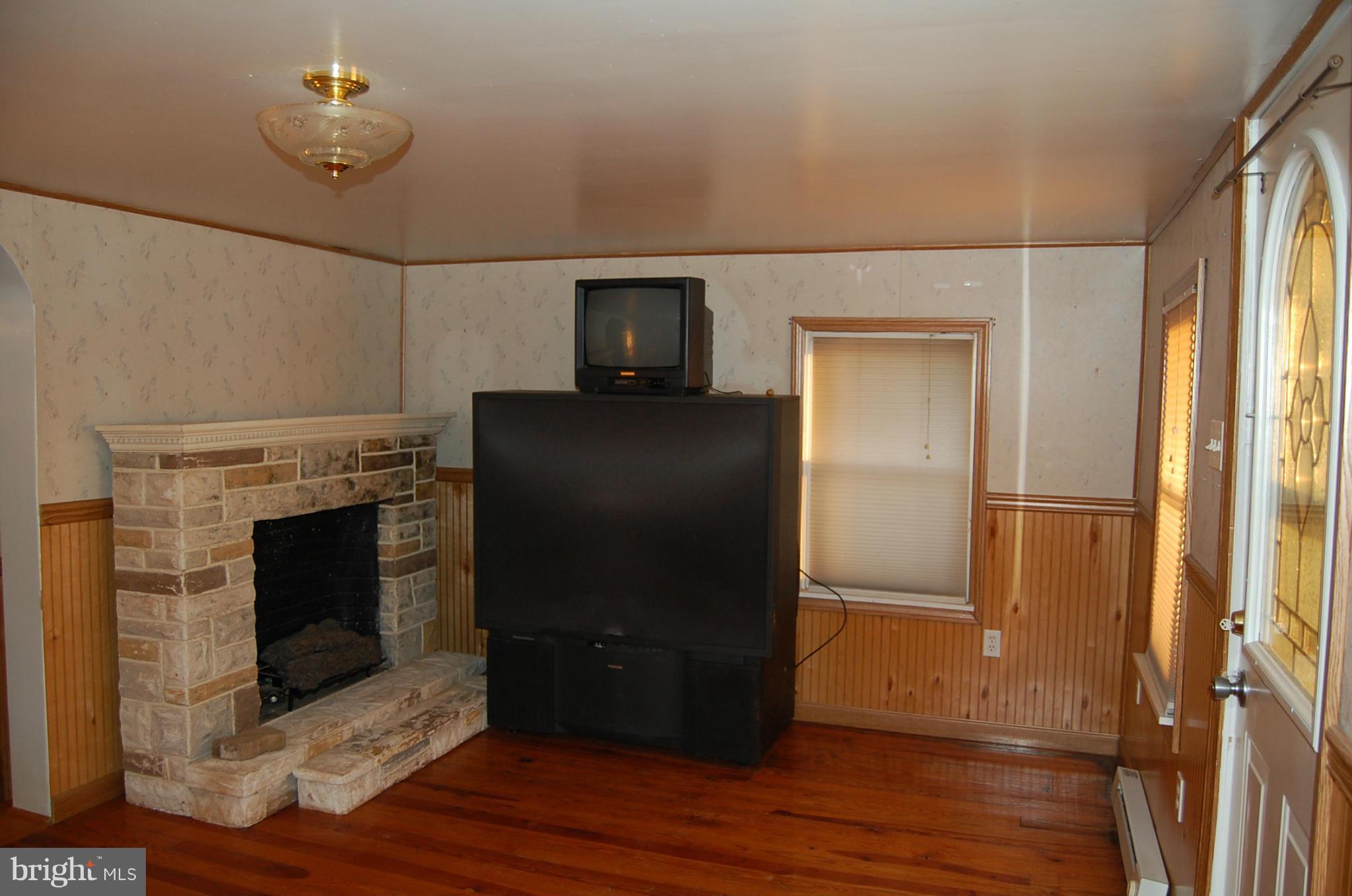 12609 Eaton Road Rocky Ridge, MD 21778 - Photo 15 of 25 a living room with a fireplace