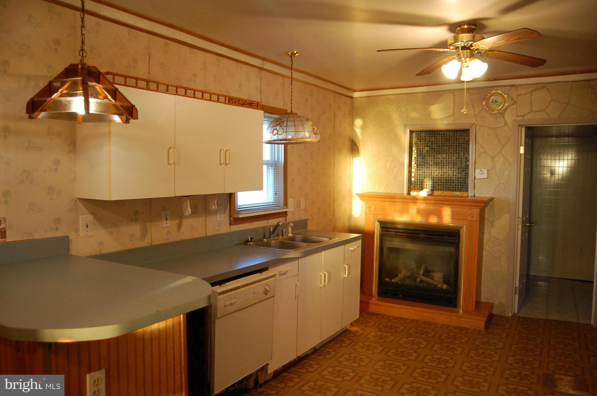 12609 Eaton Road Rocky Ridge, MD 21778 - Photo 10 of 25 a kitchen with a sink appliances and cabinets