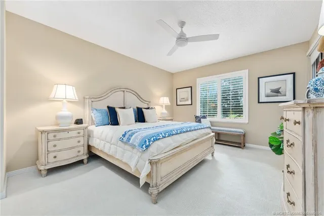 a bedroom with a large bed and a flat screen tv