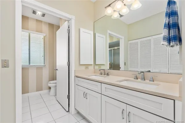 a bathroom with a glass shower door and a bathtub