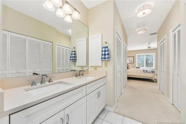 a bedroom with two beds and a window